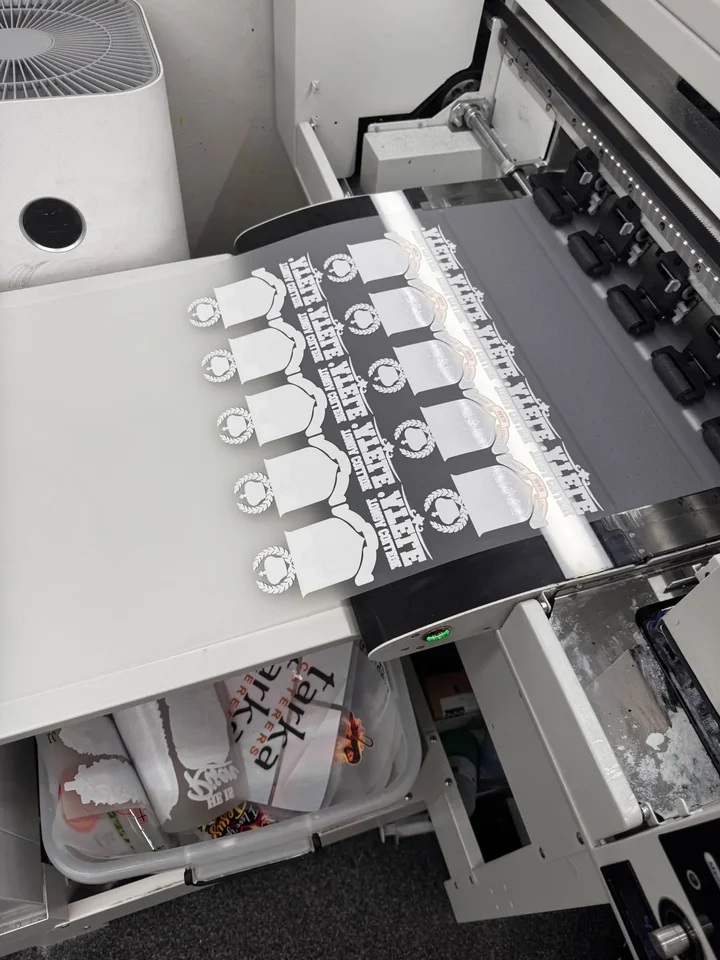 Mate Maʻa Tonga crest transfers coming off the printer